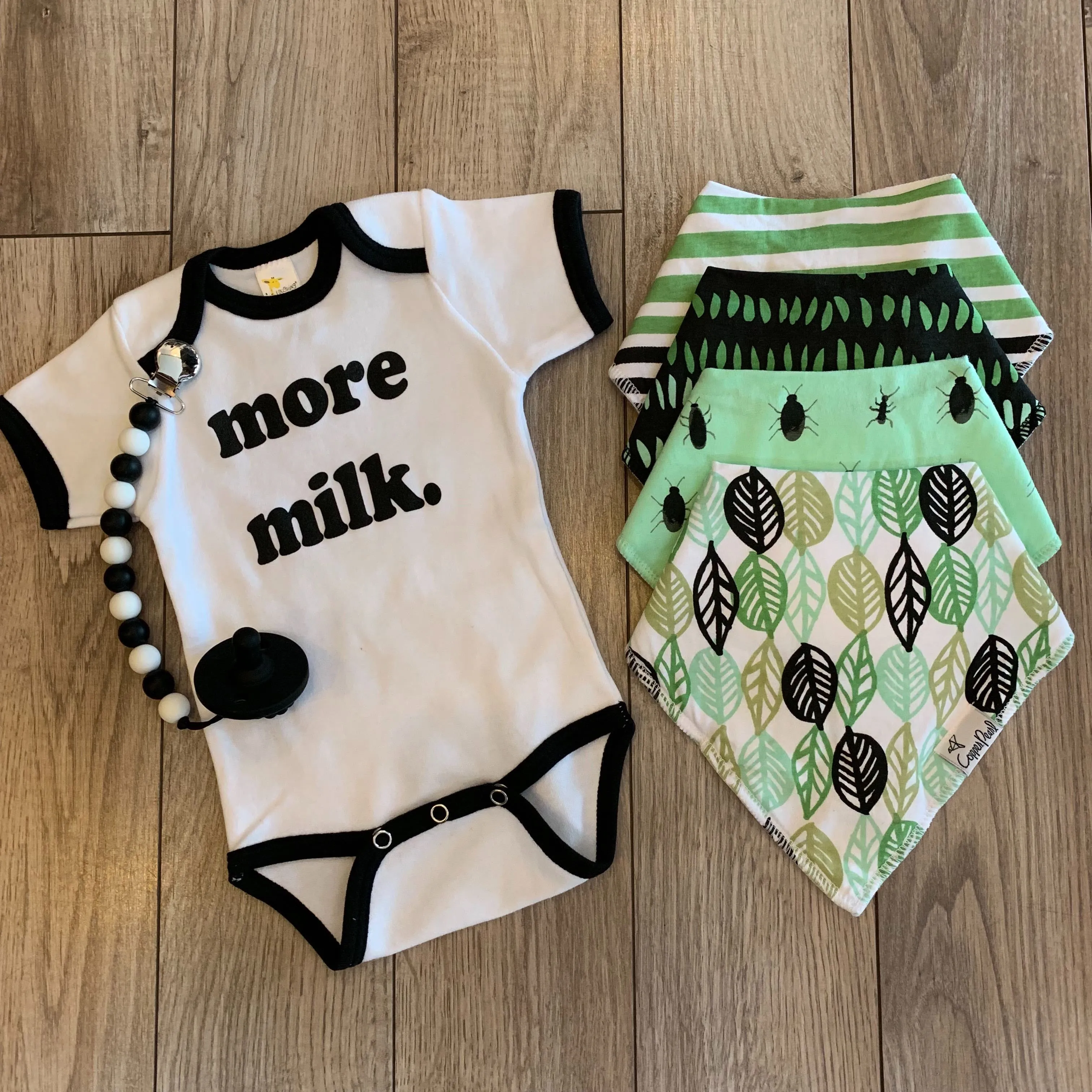 Roman & Leo - More Milk Baby Ringer Onesie in White and Black
